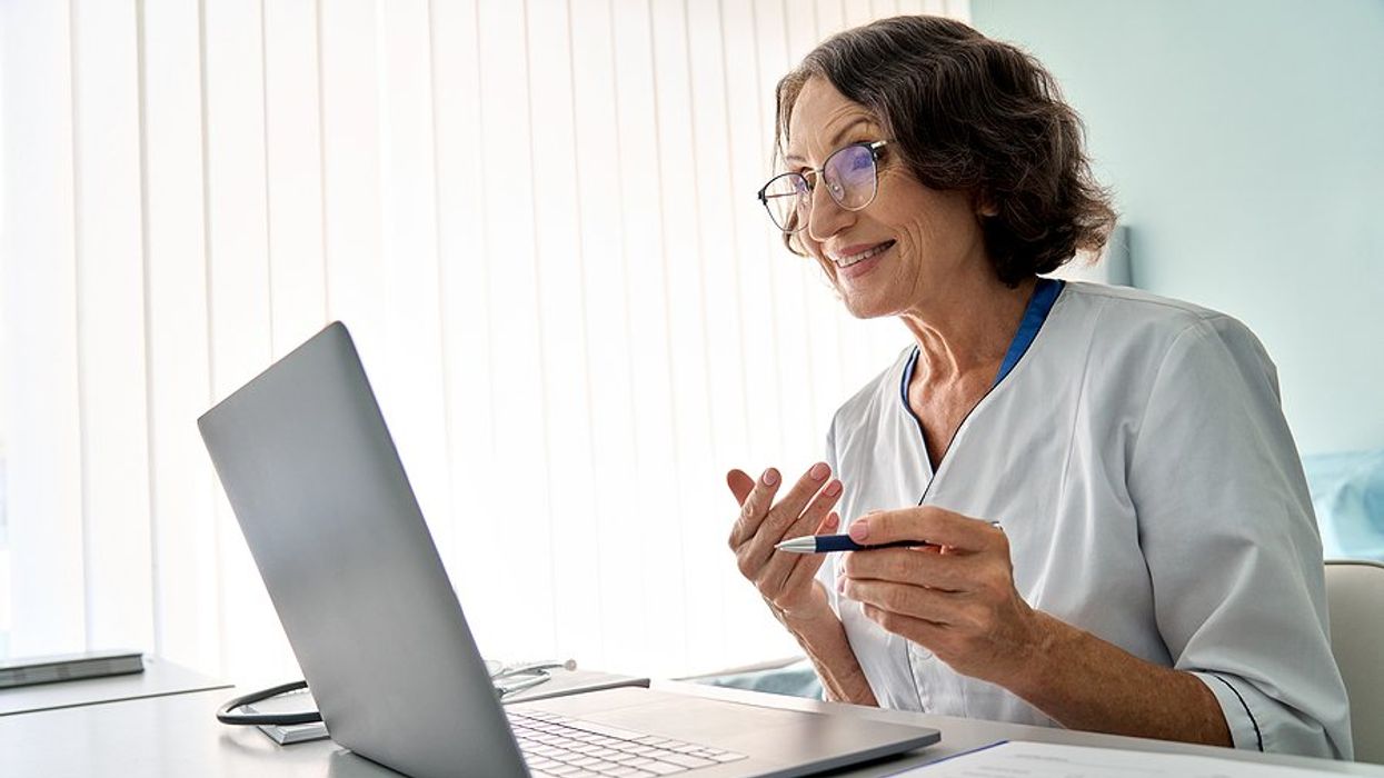 Healthcare professional/doctor talks to a patient about safety