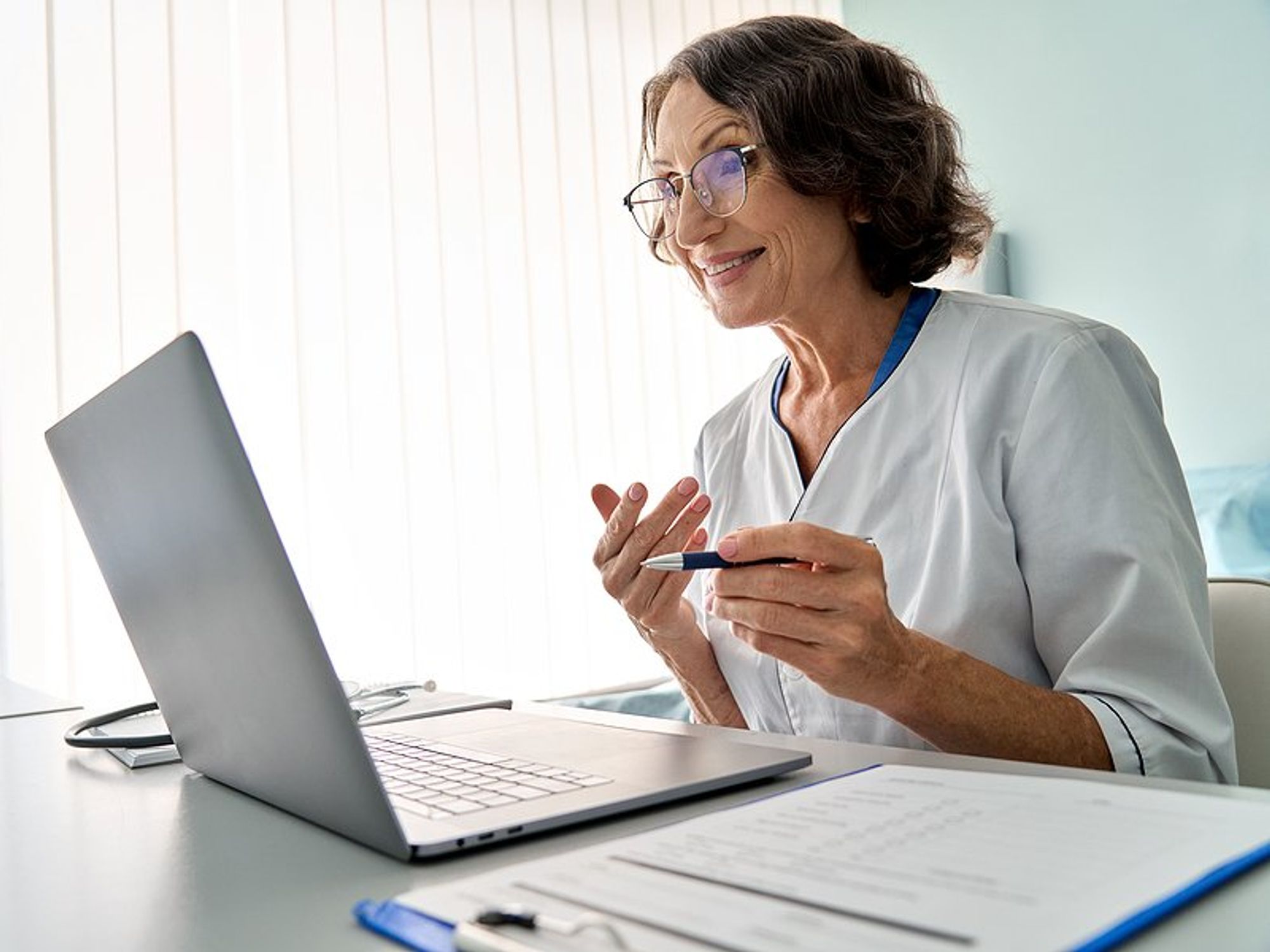 Healthcare professional/doctor talks to a patient about safety