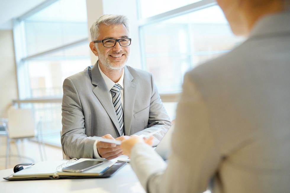 Hiring manager interviews a job candidate after COVID-19