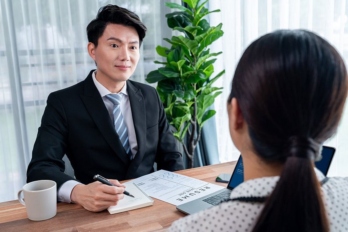 Hiring manager listens to a job candidate answer a curveball interview question