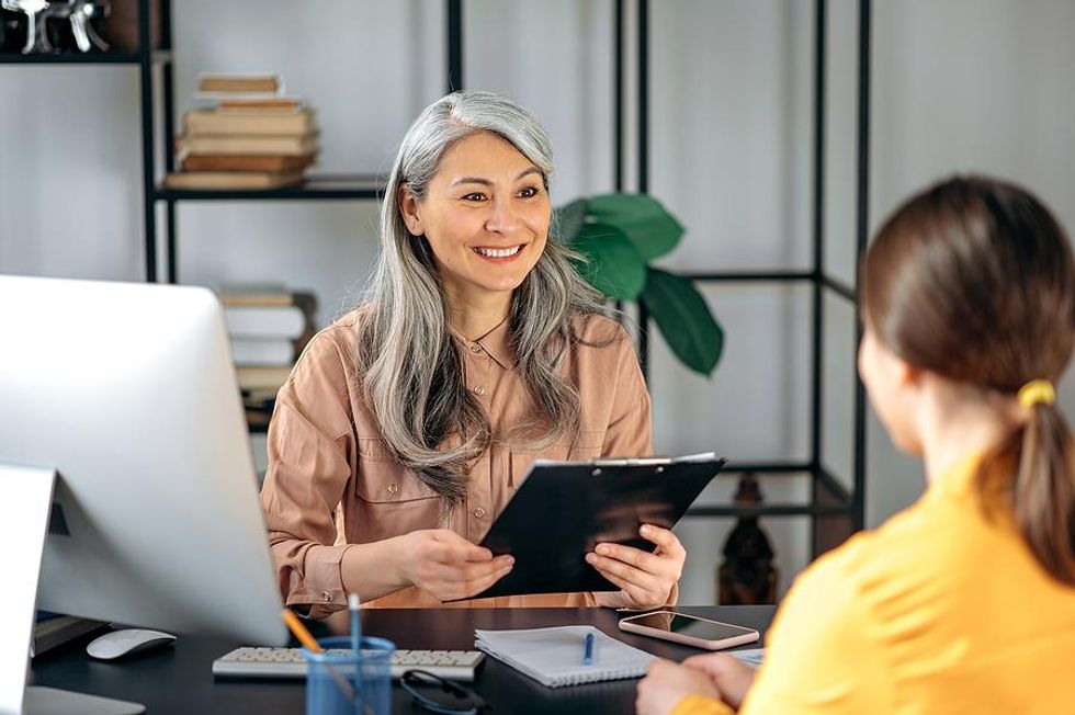 Hiring manager listens to a job candidate during an interview