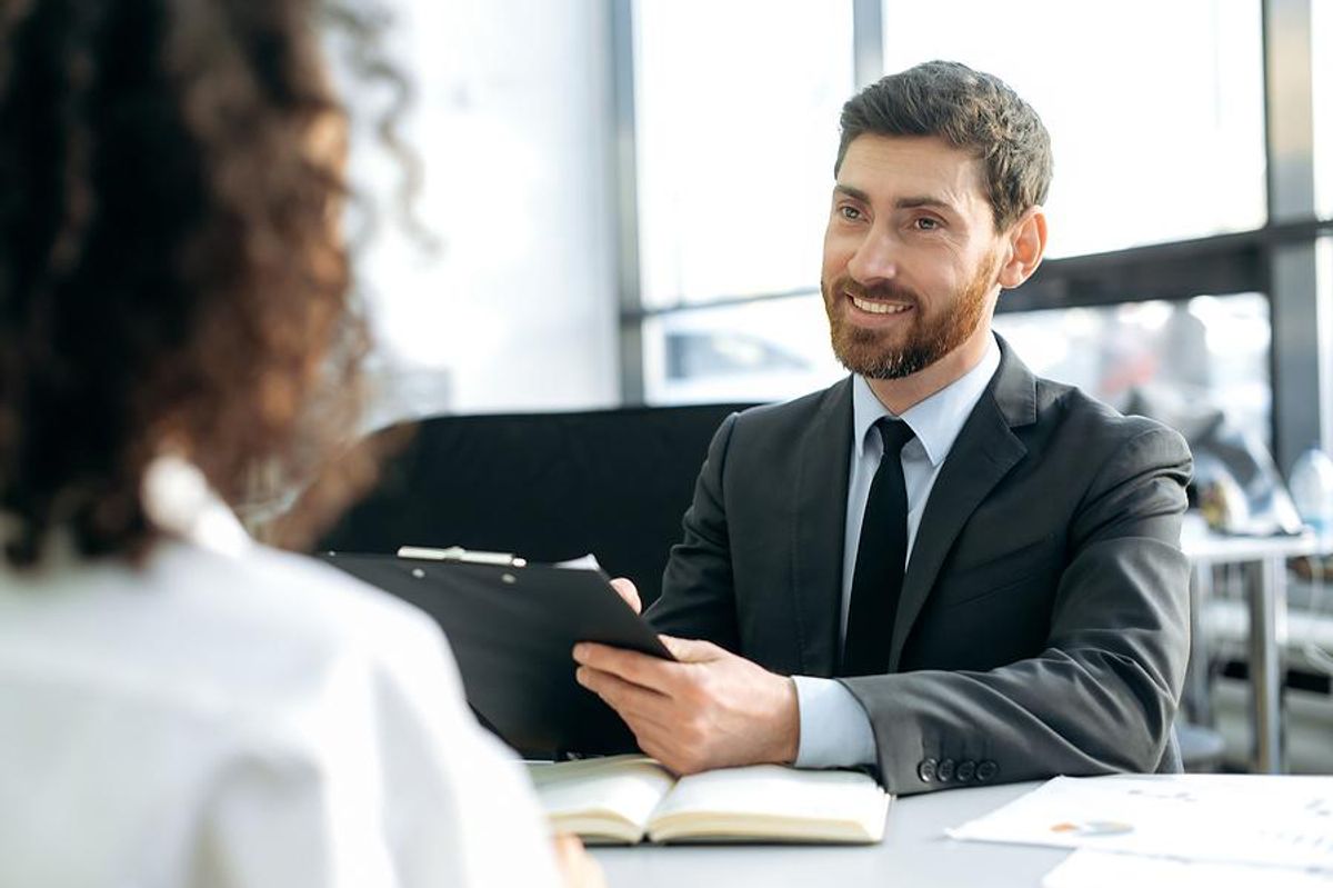 Hiring manager listens to a job candidate's answer to an interview question