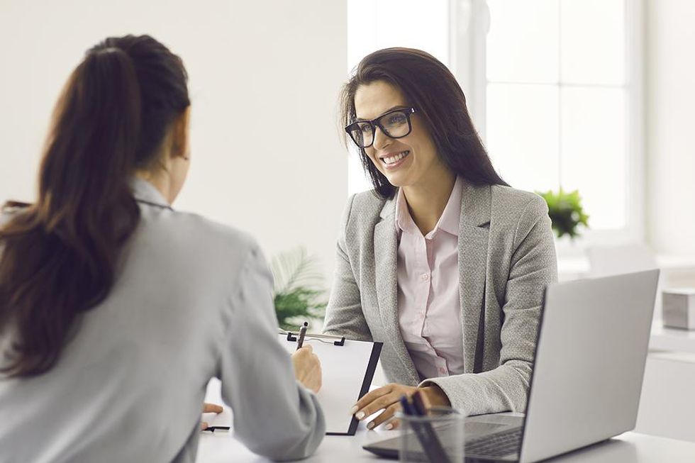 Hiring manager offers the job to the woman she is interviewing