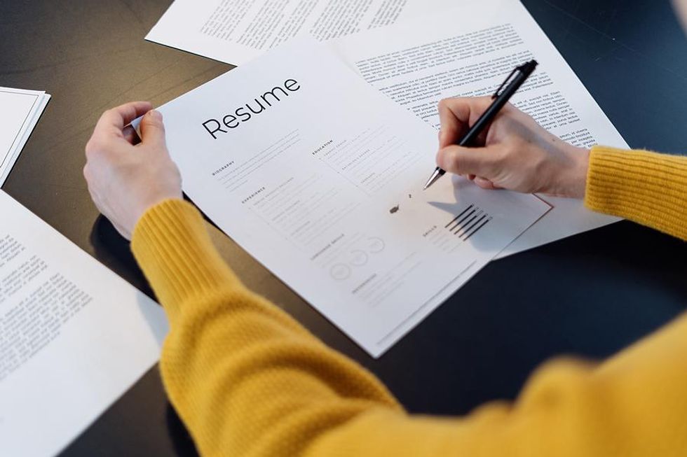 Hiring manager reviews a job applicant's resume