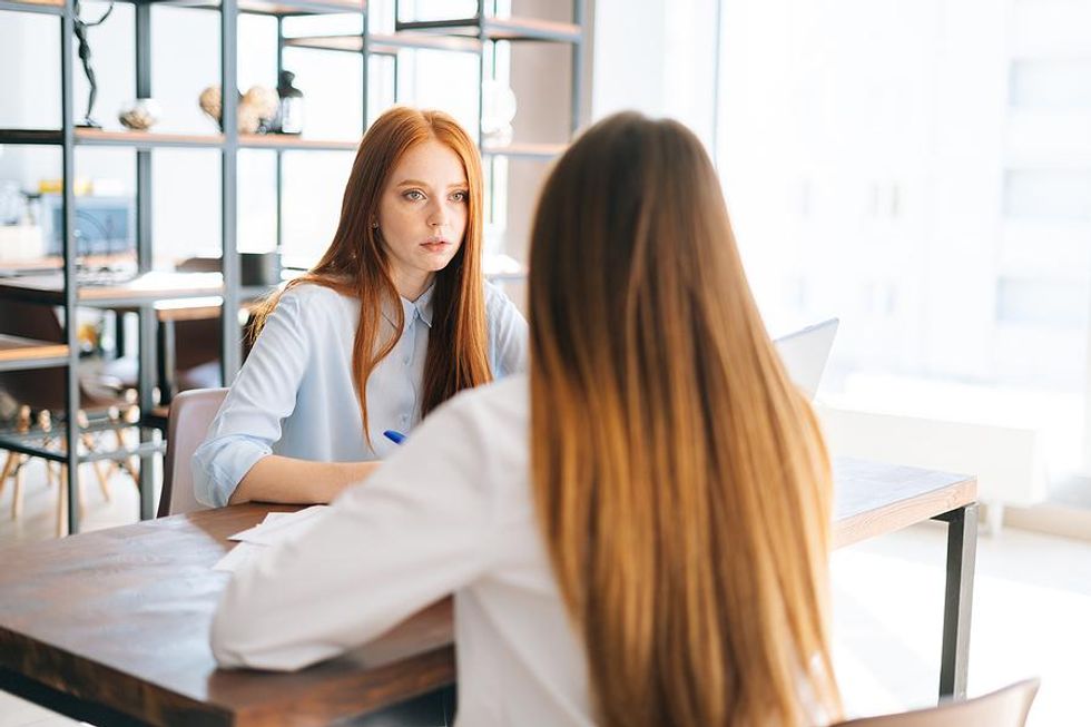 Hiring manager talks to a job candidate during a job interview