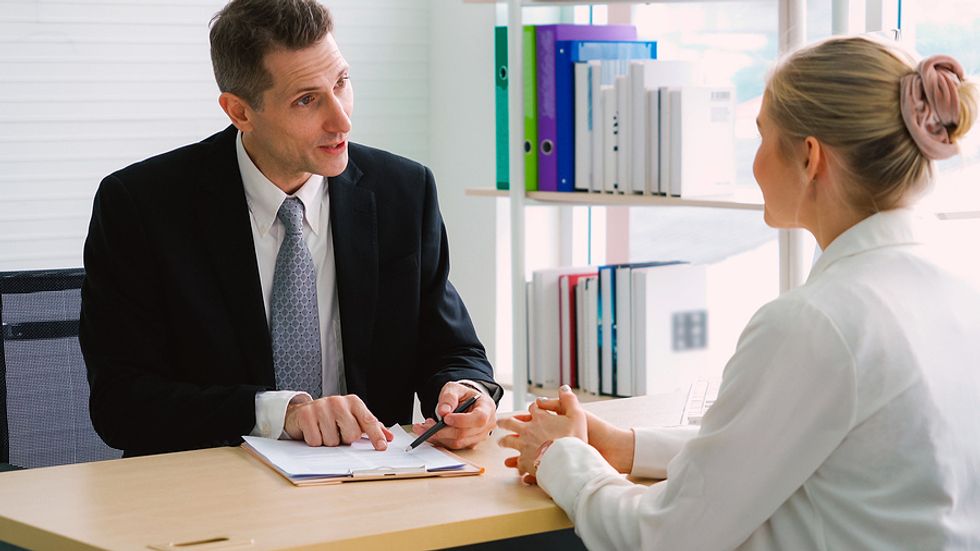 Hiring manager talks to a job candidate during an interview