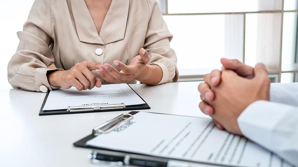 Hiring manager talks to a job candidate during an interview