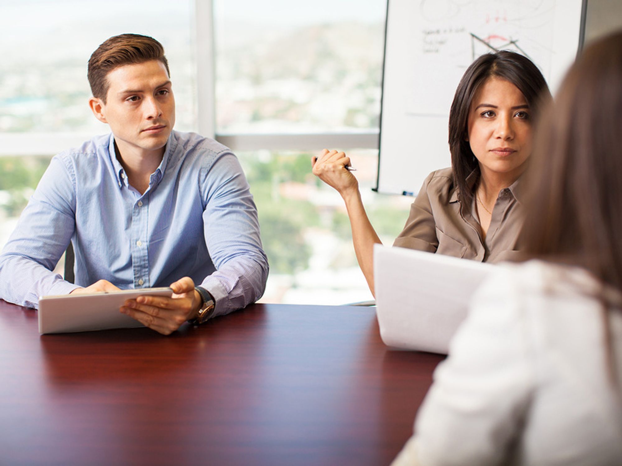 Hiring managers look at job candidate after the interview didn't go well