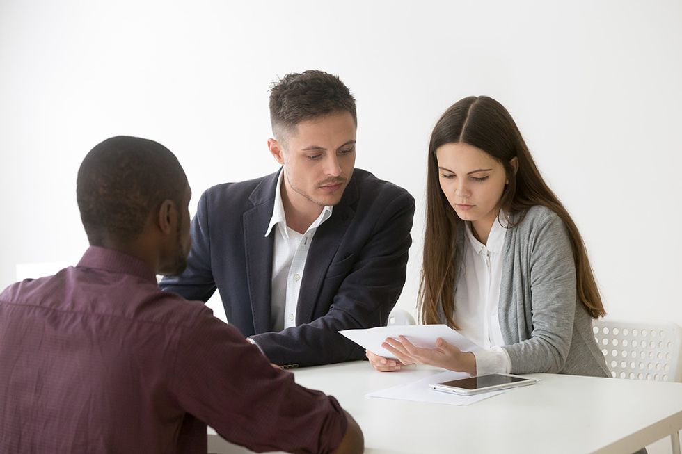 Hiring managers read about the job applicant's ROI on his resume during a job interview