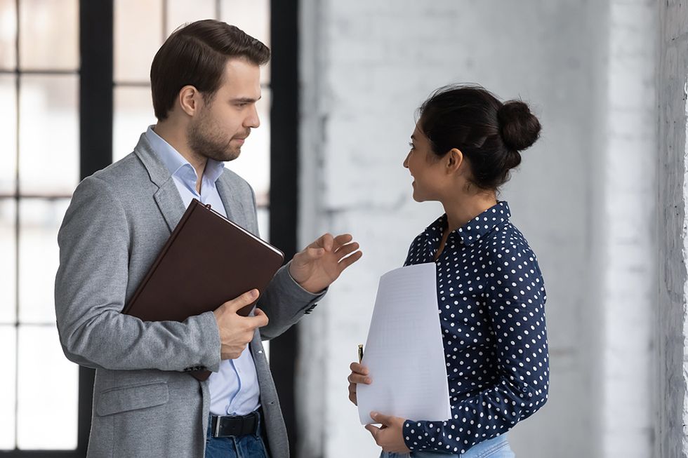 HR professional talks to coworker about the industry