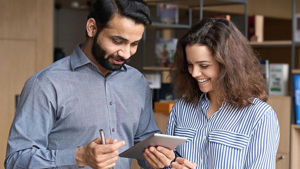 Incompetent boss talks with a coworker