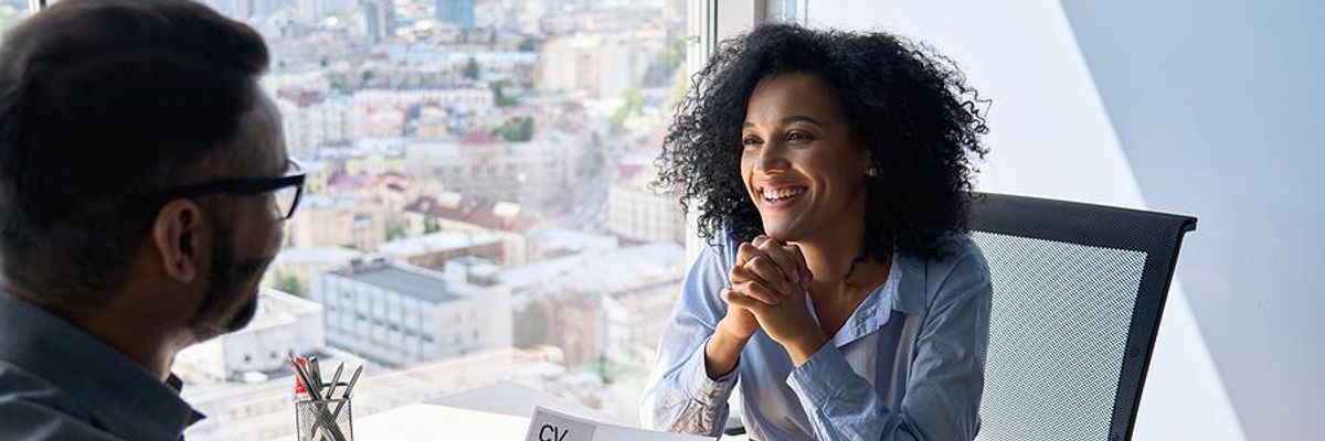 Interesting woman smiles during a job interview