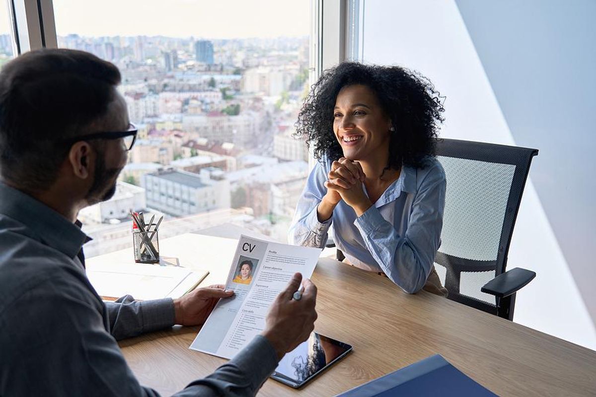 Interesting woman smiles during a job interview
