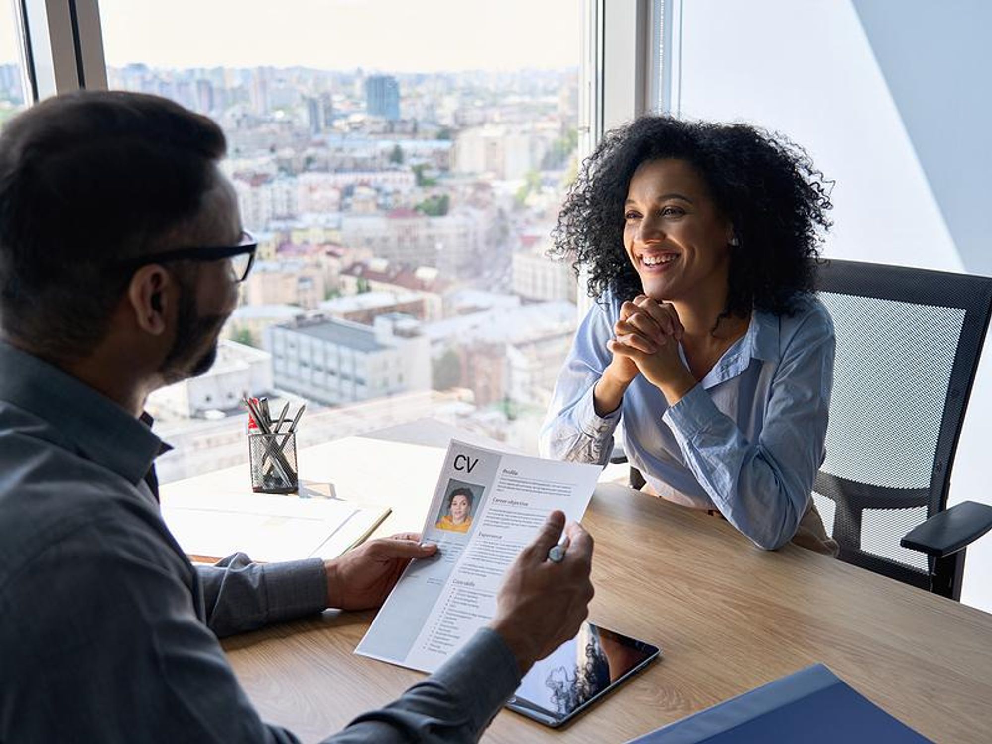 Interesting woman smiles during a job interview
