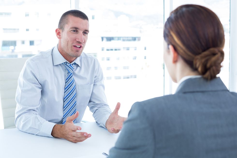 Job candidate answering "Why should we hire you?" in an interview