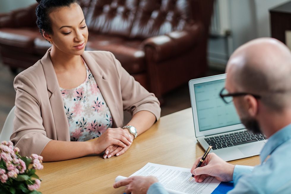 Job candidate listens to a question during an interview