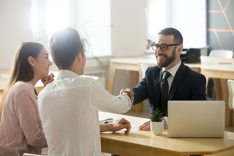 Job candidate shakes hands with the hiring manager before a job interview