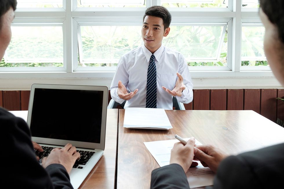 Job candidate talks about his accomplishments during an interview