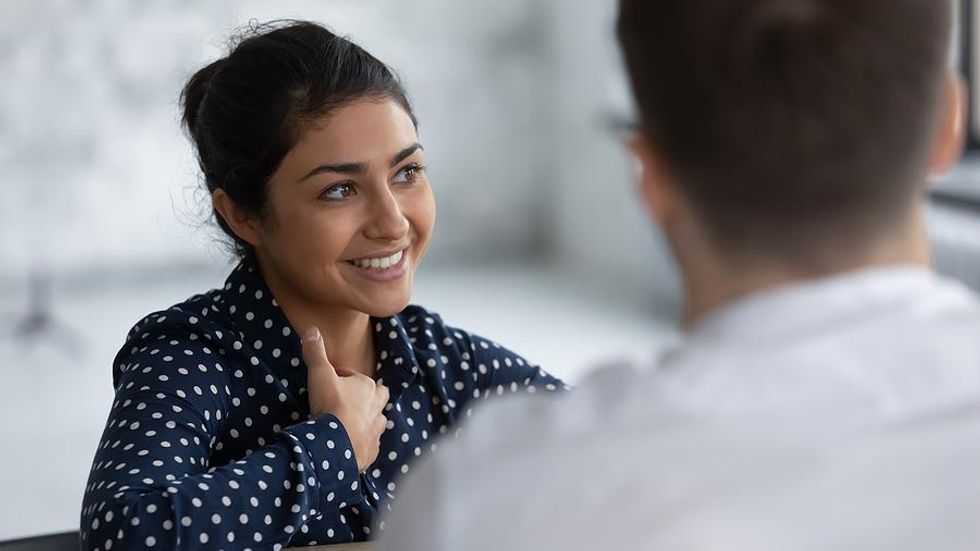 Job candidate talks to the hiring manager during an interview