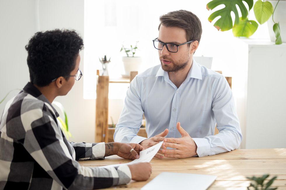 Job candidate tells the hiring manager about a time he went above and beyond at work during an interview