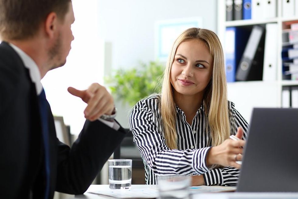 Job seeker asks HR manager about her experiences at the company during a job interview