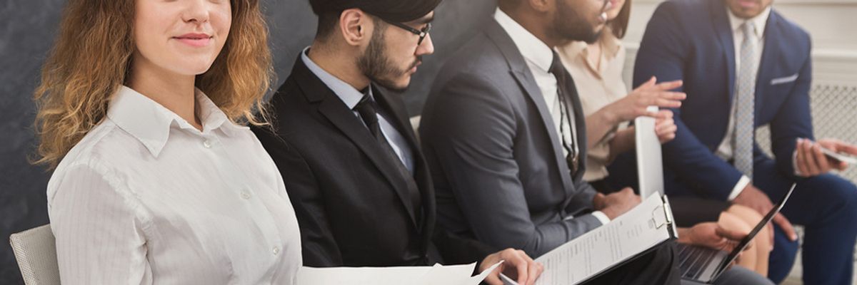 Job seeker holding her resume without any outdated phrases