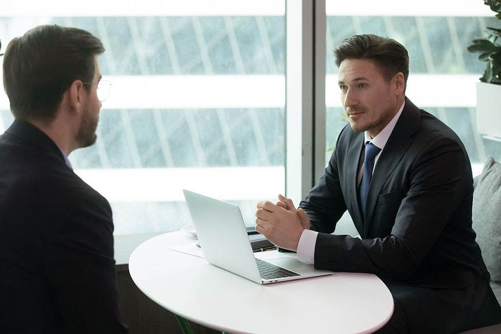 Job seeker negotiates salary with human resources professional during a job interview