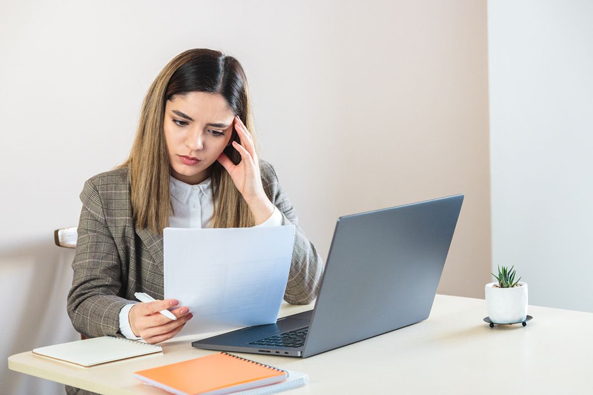 Job seeker on laptop applying for jobs she's not 100% qualified for