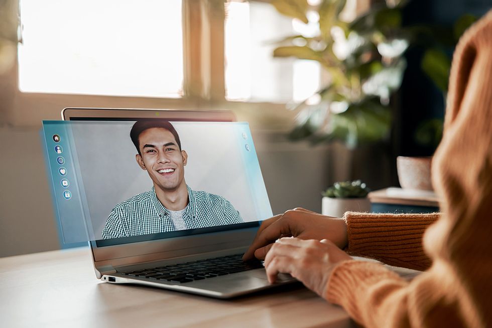 Job seeker on laptop attends a virtual interview