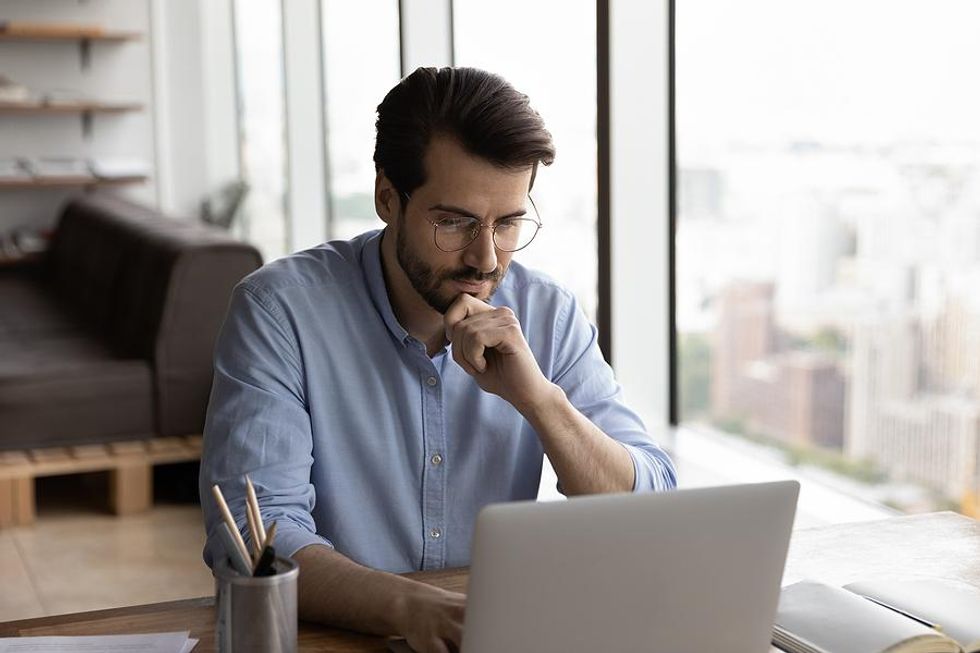 Job seeker on laptop dealing with job search fears