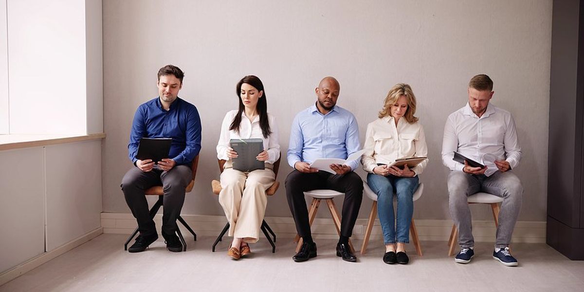 Job seekers wait and prepare for a job interview