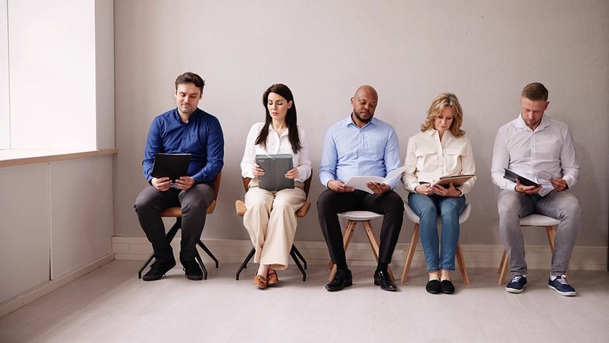 Job seekers wait and prepare for a job interview