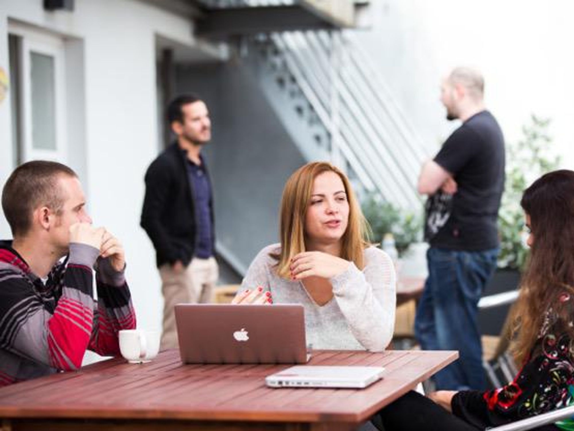 Kinsta employees collaborate with each other