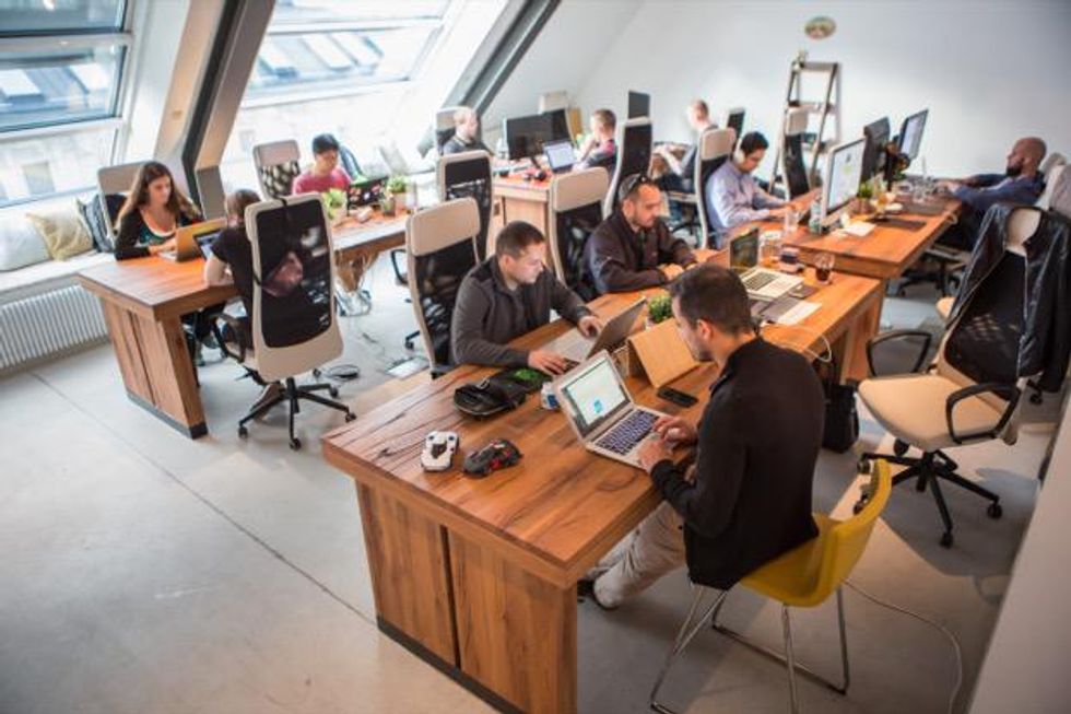 Kinsta employees hard at work at the company's headquarters.