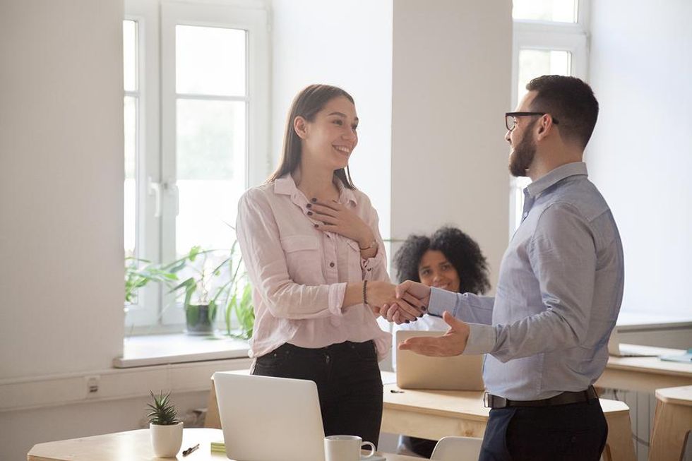 Leader motivates an employee by showing his appreciation