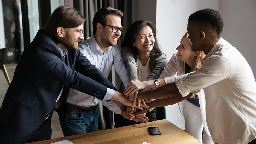 Leader motivates her team at work