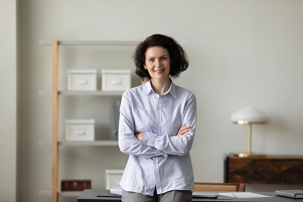 Leader stands in her office