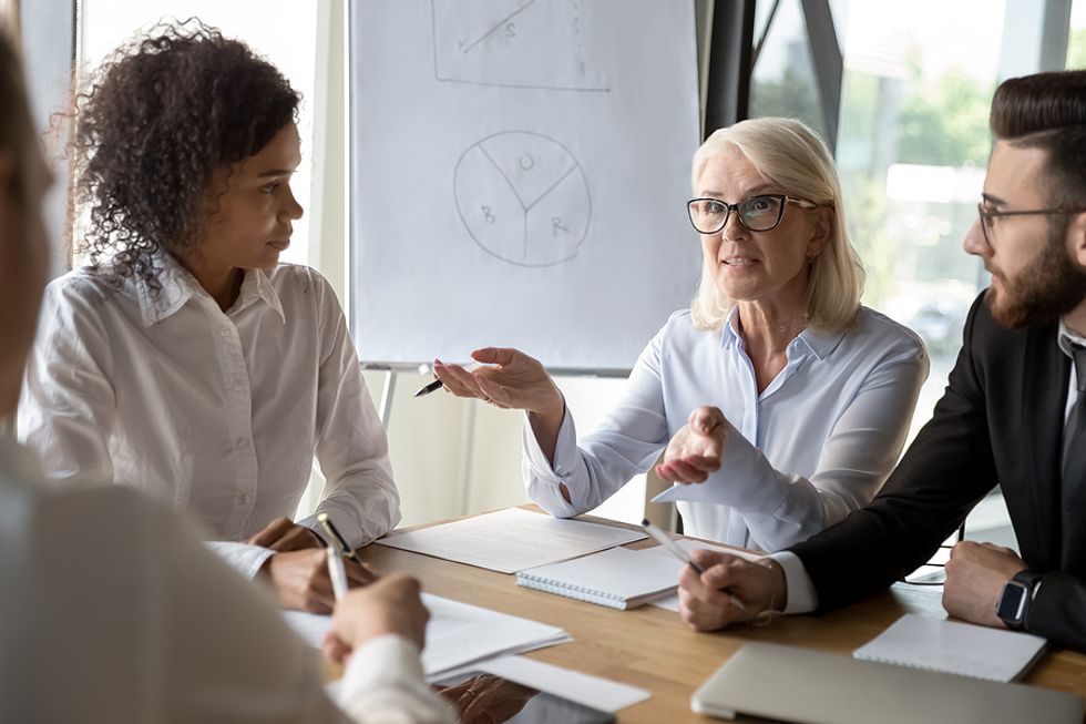 Leader talks about workplace relationships during a meeting