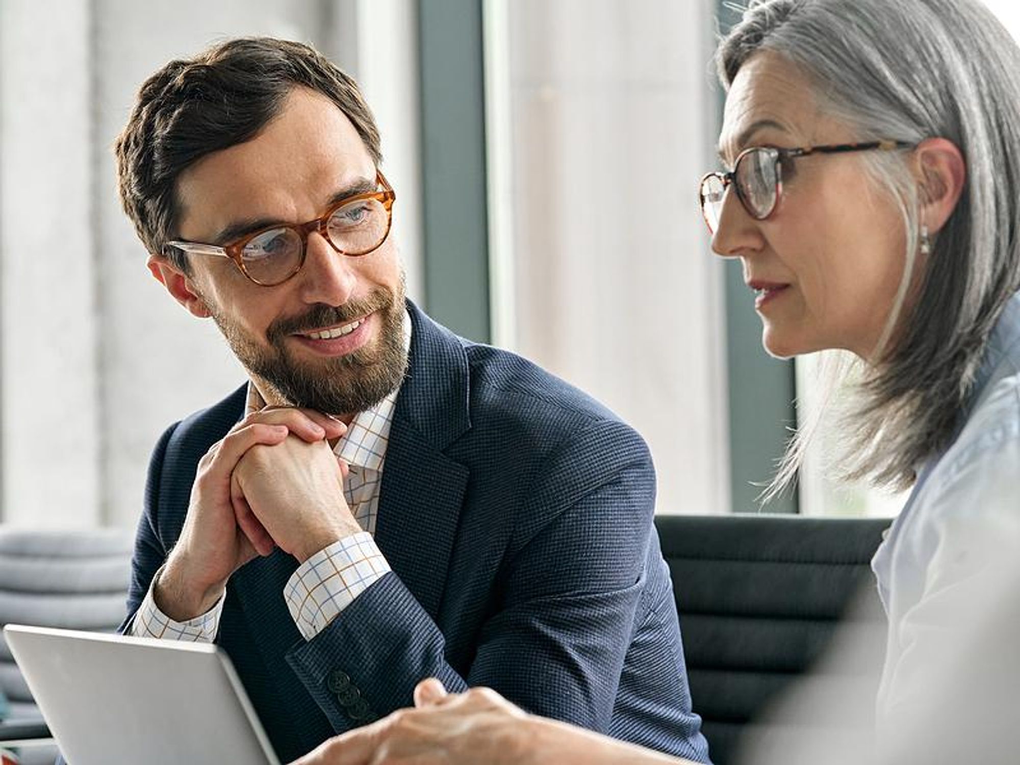 Leader talks to a colleague at work
