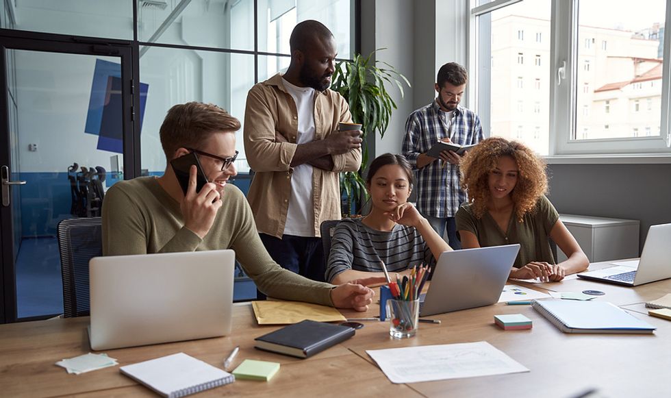 Leader talks to colleagues to build better workplace relationships