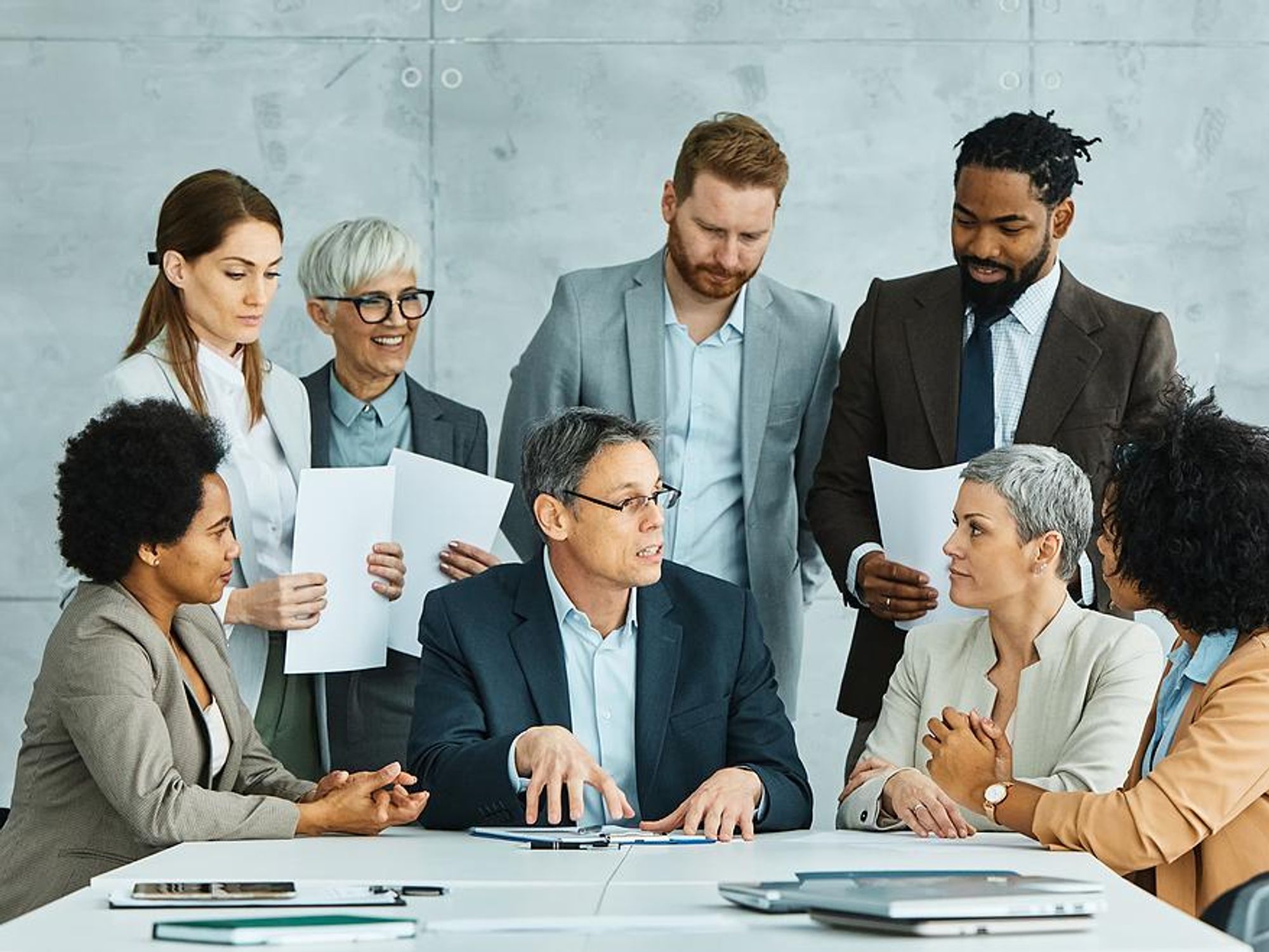Leader talks to his colleagues during a team meeting