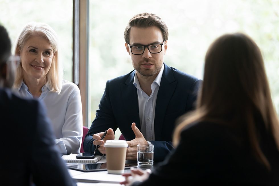 Leader talks to his team during a meeting