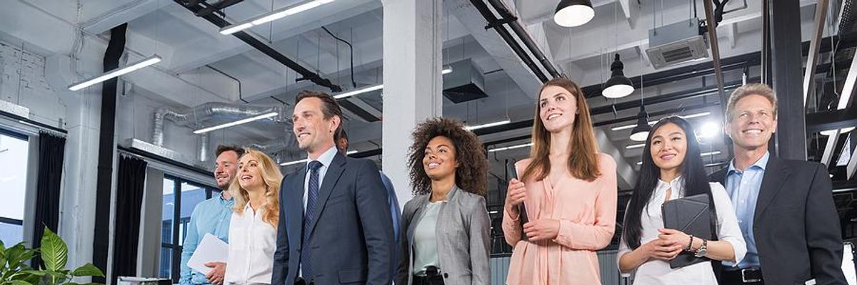 Leaders/executives and employees walking in an office