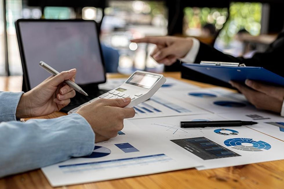 Leaders look at data during a work meeting