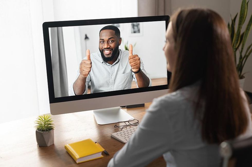 Leadership coach gives his client a thumbs up