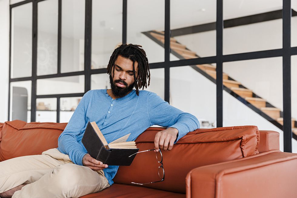 Male executive reads a book