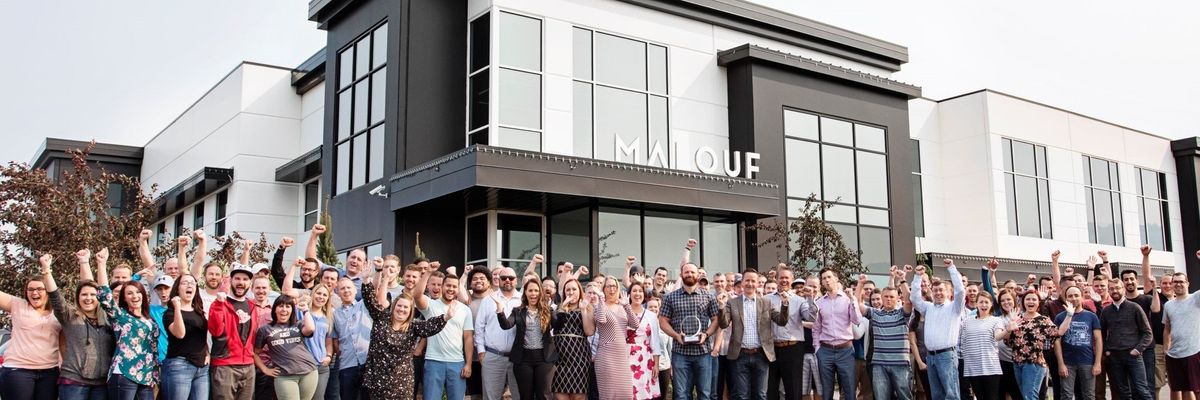Malouf employees gather outside the company's Logan, Utah headquarters.