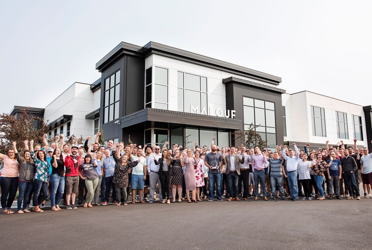Malouf employees gather outside the company's Logan, Utah headquarters.