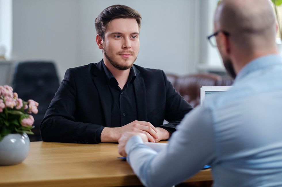 Man asking essential job interview questions