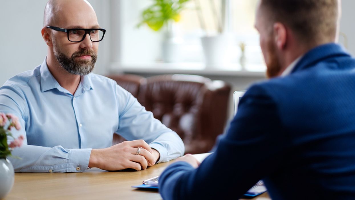 Man at a job interview afraid he'll be overqualified for the job